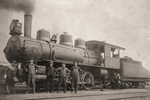 Harvey Paddock at work in the New Buffalo railroad yard. He is on the right in this photograph, his son Russell is second from left (Circa 1940)